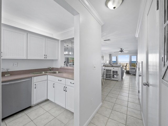 kitchen featuring ceiling fan, dishwasher, sink, and light tile patterned floors