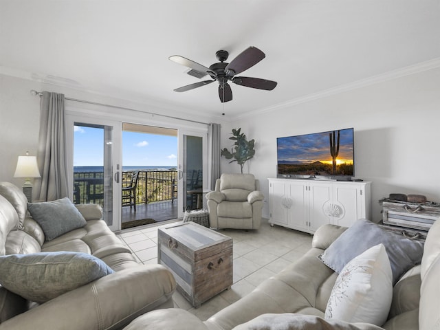 living room with light tile patterned flooring, ornamental molding, and ceiling fan