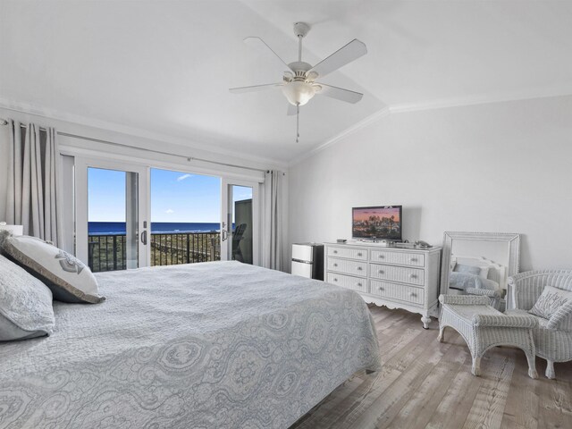 bedroom with vaulted ceiling, access to outside, ornamental molding, ceiling fan, and hardwood / wood-style floors