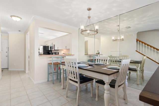 dining room featuring ornamental molding, light tile patterned floors, and a notable chandelier