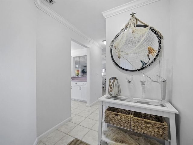 interior space featuring ornamental molding and light tile patterned flooring