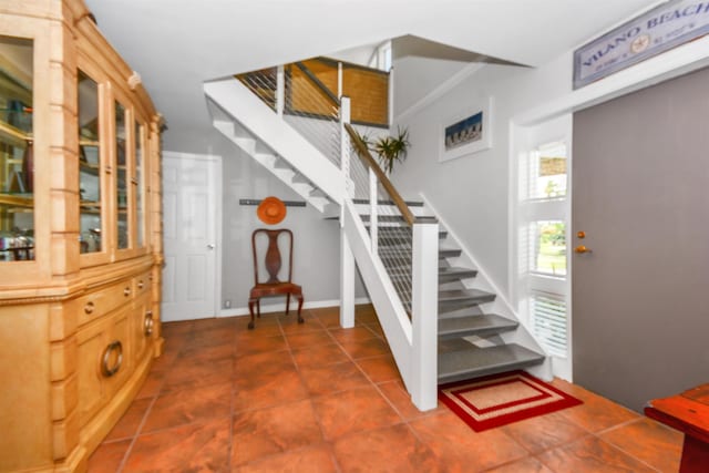 stairway featuring tile patterned floors