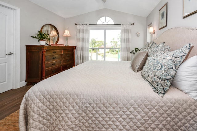 bedroom with lofted ceiling and wood-type flooring