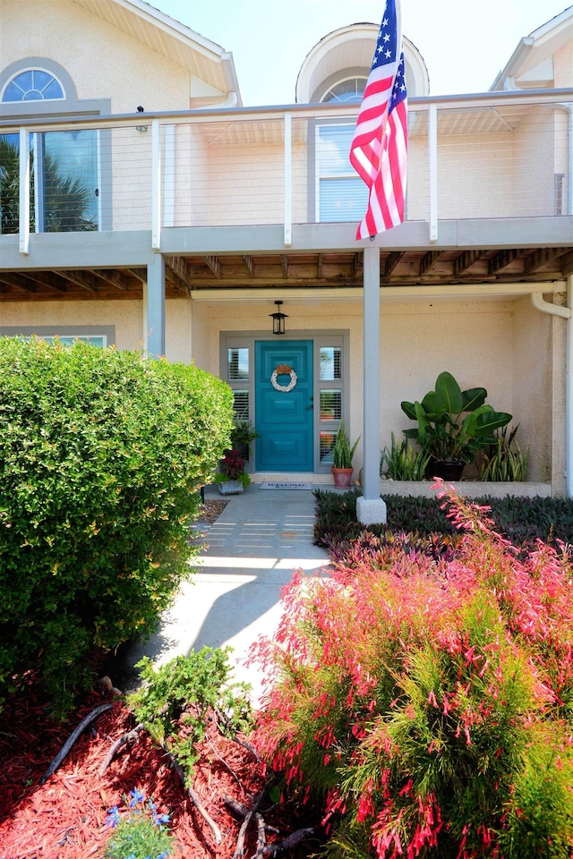 doorway to property featuring a balcony