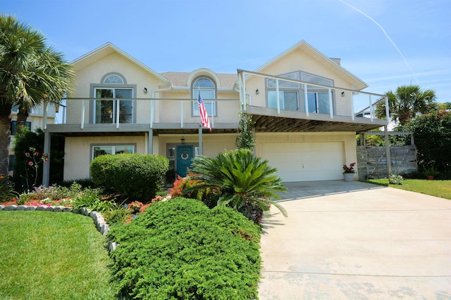 view of front of home with a balcony and a garage