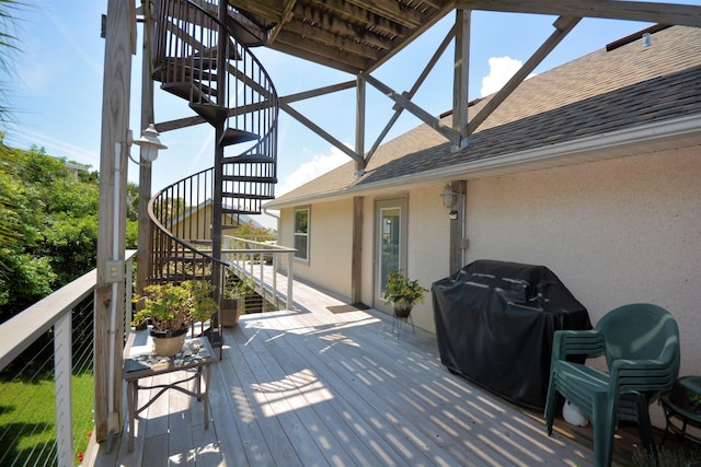 wooden deck featuring grilling area