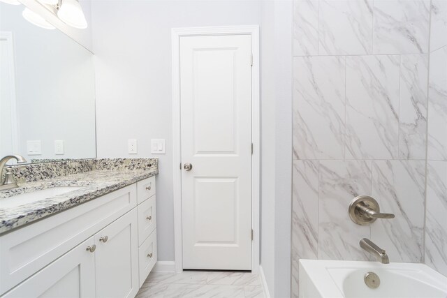 679 Coral Cir, Saint Augustine, FL 32080 - full bath with vanity, marble finish floors, and washtub / shower combination