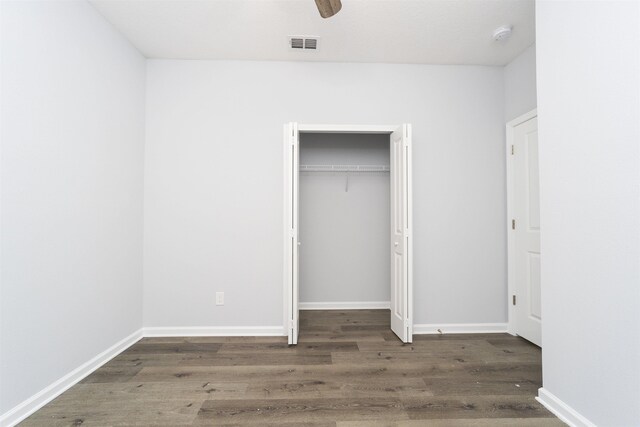 679 Coral Cir, Saint Augustine, FL 32080 - unfurnished bedroom with wood finished floors, a closet, and ceiling fan