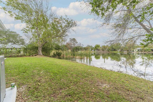679 Coral Cir, Saint Augustine, FL 32080 - view of green lawn with a water view