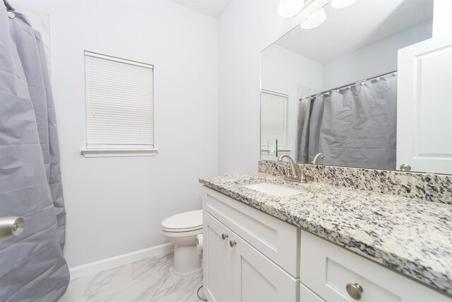 679 Coral Cir, Saint Augustine, FL 32080 - bathroom with vanity, marble look tiles, and a shower with shower curtain