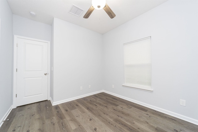 spare room with wood-type flooring and ceiling fan