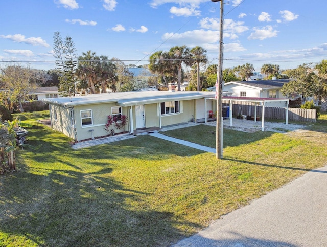 ranch-style home with a front yard