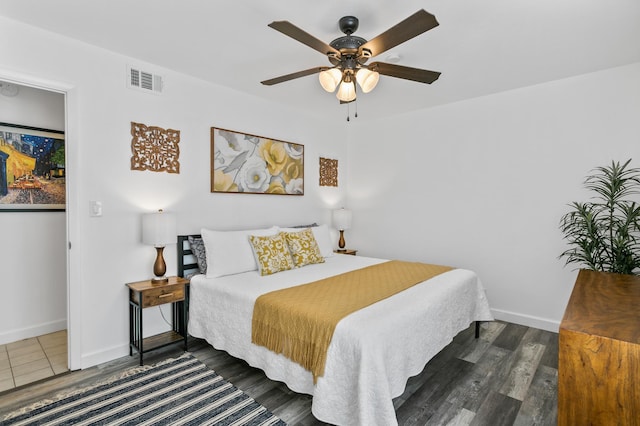 bedroom featuring dark wood-type flooring and ceiling fan