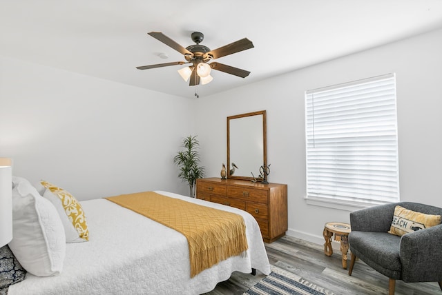 bedroom featuring ceiling fan and light wood-type flooring