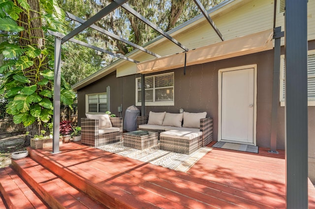 wooden deck featuring outdoor lounge area and a pergola