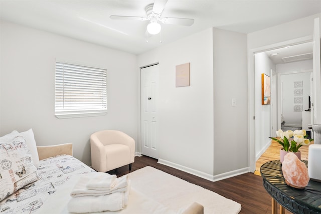 bedroom featuring baseboards, ceiling fan, and wood finished floors