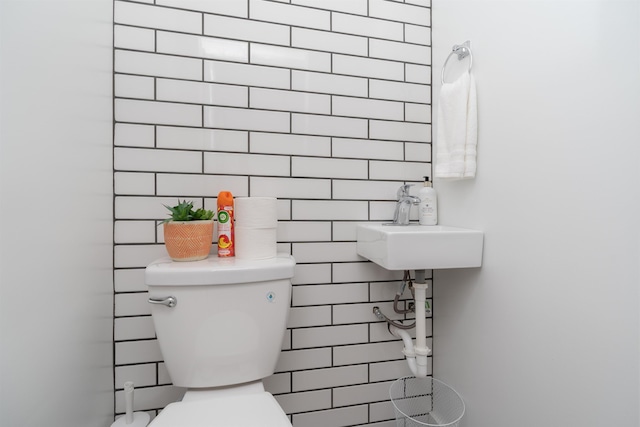 bathroom with toilet and a sink