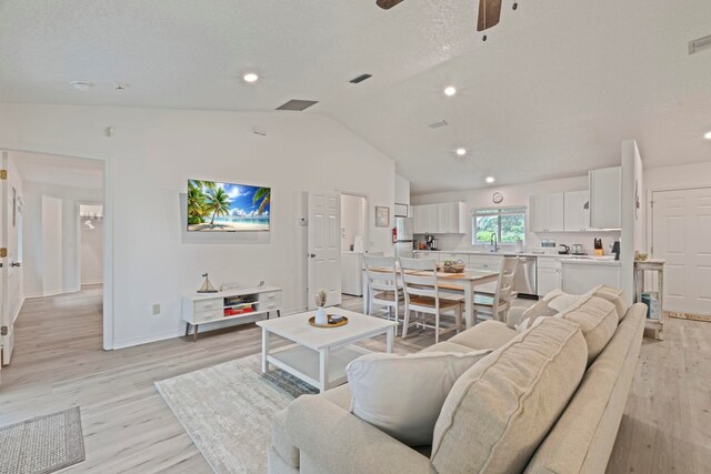 110 Dory Rd, Saint Augustine, FL 32086 - living area with light wood-style floors, vaulted ceiling, a ceiling fan, recessed lighting, and baseboards