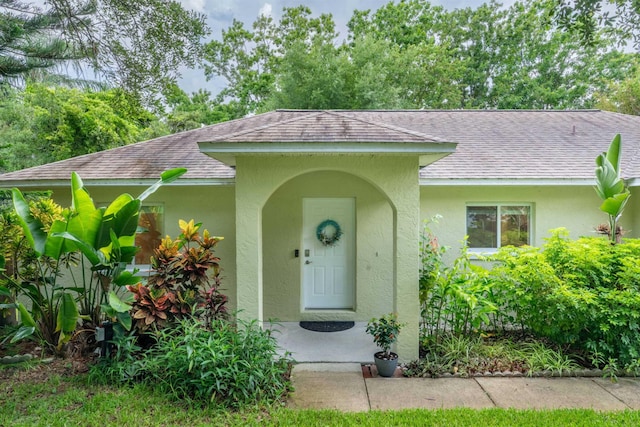 110 Dory Rd, Saint Augustine, FL 32086 - property entrance featuring roof with shingles and stucco siding