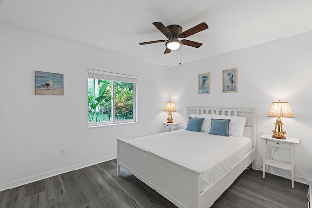 110 Dory Rd, Saint Augustine, FL 32086 - bedroom with dark wood-style floors, baseboards, a textured ceiling, and a ceiling fan