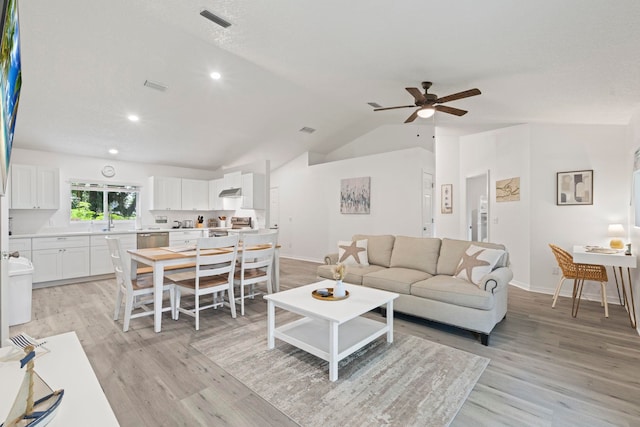 110 Dory Rd, Saint Augustine, FL 32086 - living room featuring light wood-style floors, vaulted ceiling, ceiling fan, baseboards, and recessed lighting