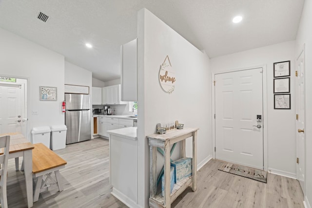 110 Dory Rd, Saint Augustine, FL 32086 - entrance foyer with vaulted ceiling, light wood-style flooring, recessed lighting, and baseboards