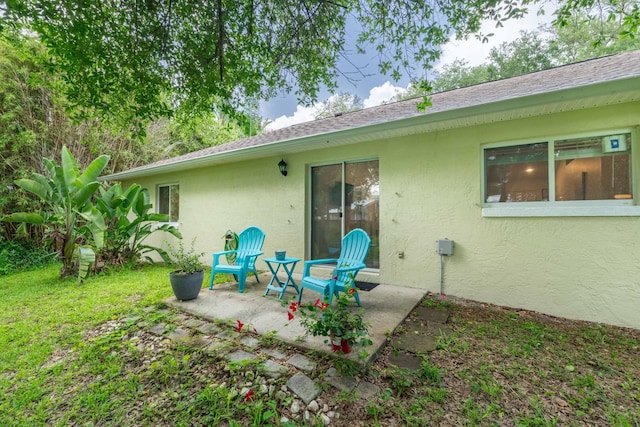 110 Dory Rd, Saint Augustine, FL 32086 - rear view of house featuring stucco siding and a patio
