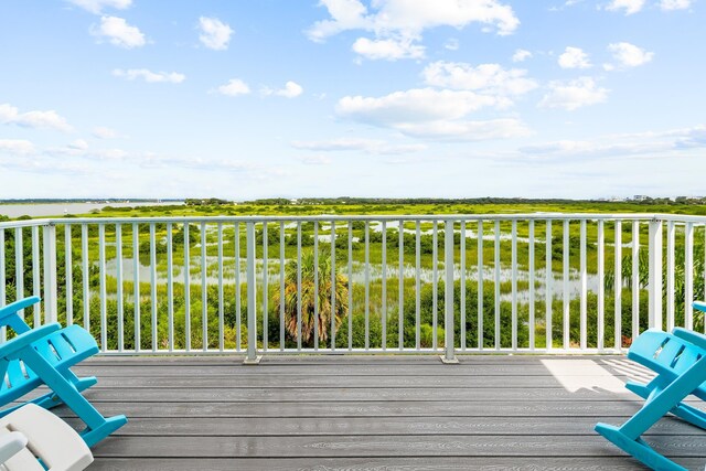 wooden terrace with a water view