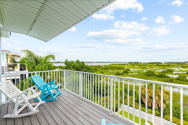 wooden terrace with a water view