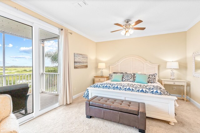 bedroom featuring access to exterior, light colored carpet, ceiling fan, and ornamental molding