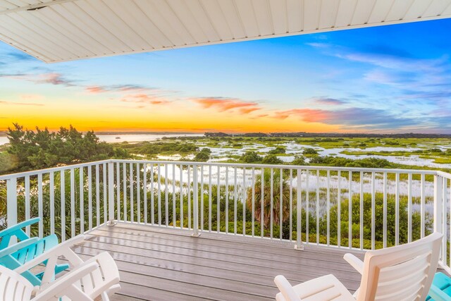 deck at dusk with a water view