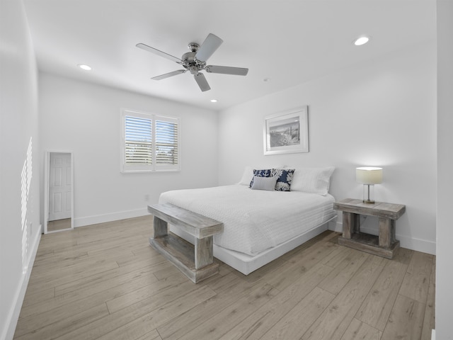 bedroom featuring ceiling fan and light hardwood / wood-style floors