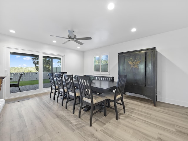 dining space featuring ceiling fan and light wood-type flooring