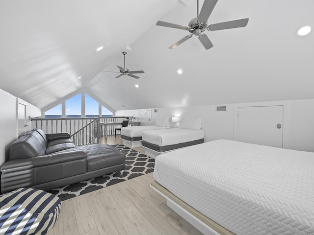 bedroom featuring light hardwood / wood-style floors, ceiling fan, and vaulted ceiling