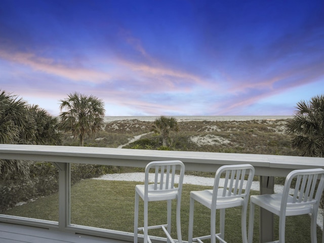 view of balcony at dusk