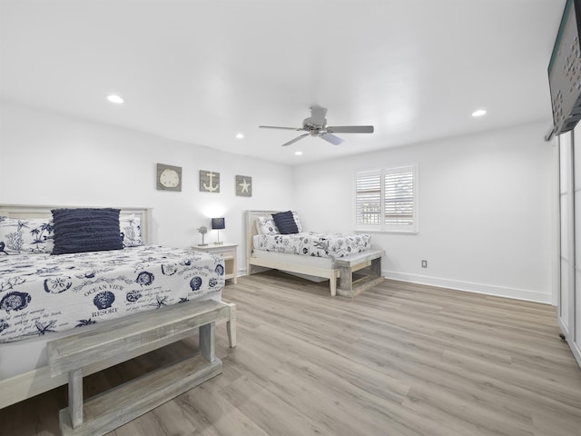 bedroom featuring ceiling fan and light hardwood / wood-style floors