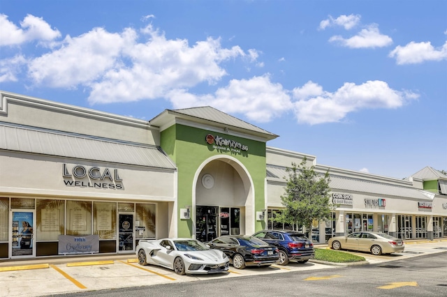 view of property with uncovered parking