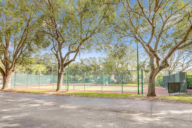 view of sport court with fence