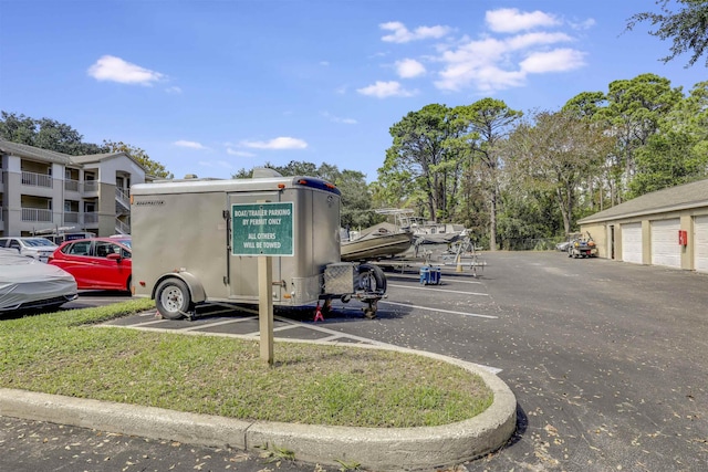 uncovered parking lot featuring community garages