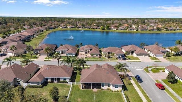 birds eye view of property with a residential view and a water view