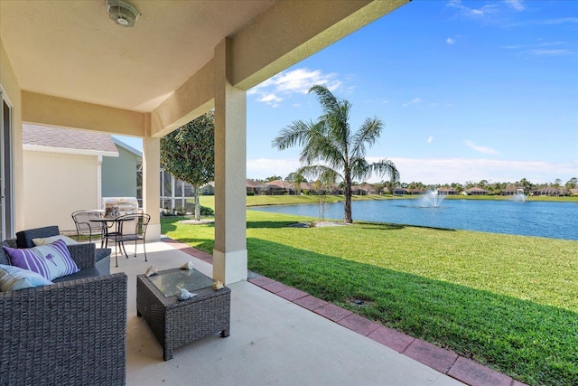 view of patio / terrace with a water view