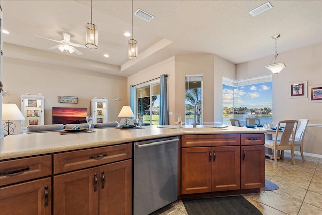 kitchen featuring dishwasher, hanging light fixtures, open floor plan, and visible vents