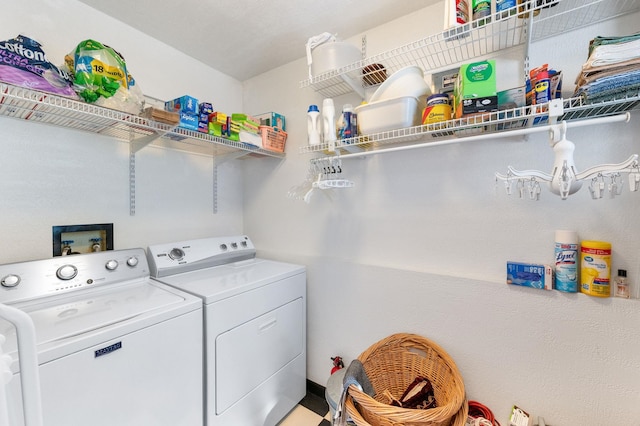 washroom featuring washing machine and dryer