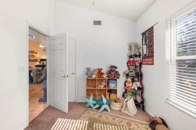 carpeted bedroom featuring lofted ceiling