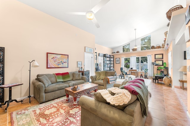 living room featuring high vaulted ceiling, light tile patterned floors, and ceiling fan