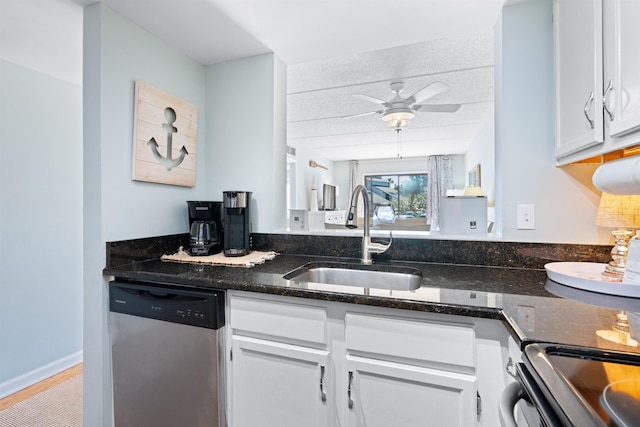 kitchen with a sink, dark stone countertops, white cabinetry, dishwasher, and ceiling fan