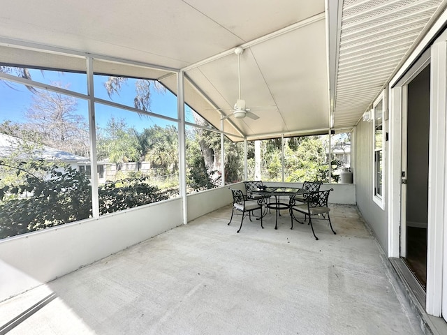 sunroom featuring a wealth of natural light, lofted ceiling, and a ceiling fan