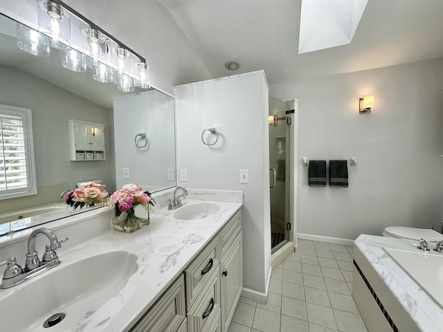 bathroom featuring a sink, a stall shower, tile patterned floors, and vaulted ceiling