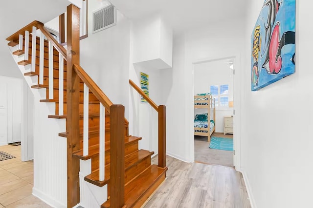 stairway featuring hardwood / wood-style flooring