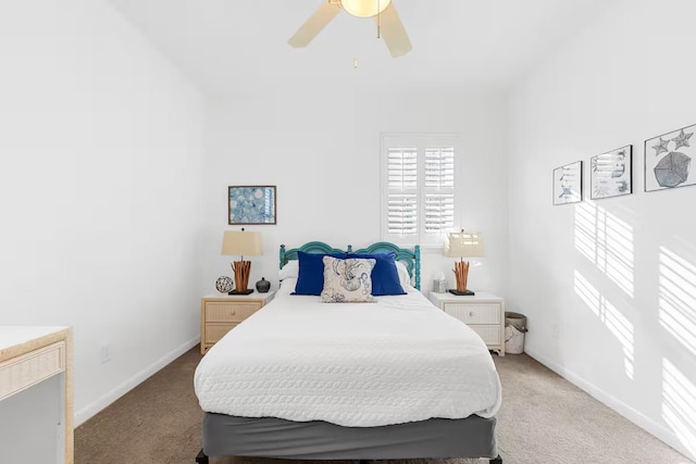 bedroom featuring ceiling fan and light carpet